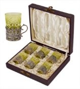 A boxed set of Continental silver and glass liquor glasses, probably 1920s, the six liquor glasses