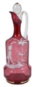 A 19th century Mary Gregory red glass decanter, with white enamel decoration of a young boy