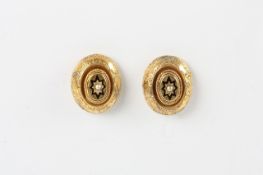 A pair of Victorian oval shaped earring, with chased and black enamel decoration set with seed pearl