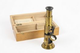 A brass compound microscope, French, unsigned, the lacquered brass microscope with single