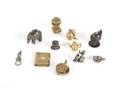 A small and interesting collection of novelty miniature charms and seals, mainly late 19th century