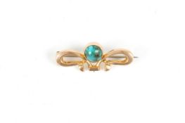 A 9ct gold and turquoise Art Nouveau brooch by RBS, the ribbon shaped gold brooch with set