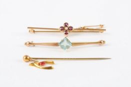 Two 9ct gold bar brooches, one set with garnet and centre pearl in flower setting, the other set
