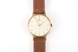 A 9ct gold Jaeger Le Coultre gents wrist watch, circa 1960, with baton numerals and silvered dial,