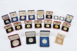 A collection of silver and white metal collectors souvenir coins, from the Isle of Man, Jamaica,