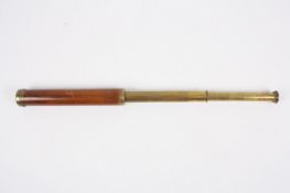 A brass and mahogany two draw refracting telescope, circa 1800, unsigned, 24cm unextended, 54.5cm