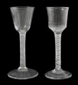 Two 18th century opaque twist stem cordial glasses, one with bell shaped bowl, the other with