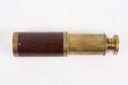 A brass and mahogany single draw pocket refracting telescope, unsigned, 11.5cm unextended 17cm