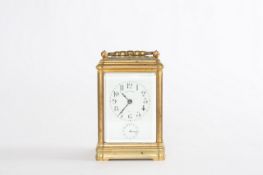 A French repeating carriage clock with alarm in gorge case, circa 1895, with white enamel dial,