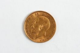 A George V 1911 22ct gold half sovereign, in fitted case. 4 grams Some wear.