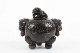 A Chinese black quartz carved globular vase and cover, circa 1900, carved with incised dogs of