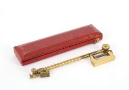 A brass camera lucida in case, circa 1850, unsigned, contained within a fitted red leather covered