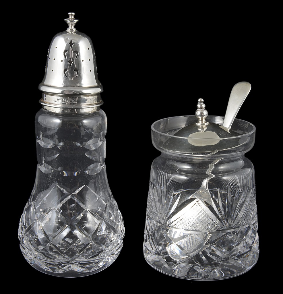 A silver and glass Mappin & Webb conserve jar, and sugar sifter, the lid of the jar hallmarked