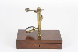 A simple botanical microscope, circa 1810, the brass pillar with rack and pinion focussing,