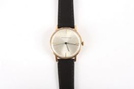 A 9ct gold Mappin & Webb gents wrist watch, the silvered dial with baton numerals and set in a 9ct