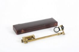 A brass camera lucida in fitted red Morocco leather case, late 19th century, 23.5cm wide Appears