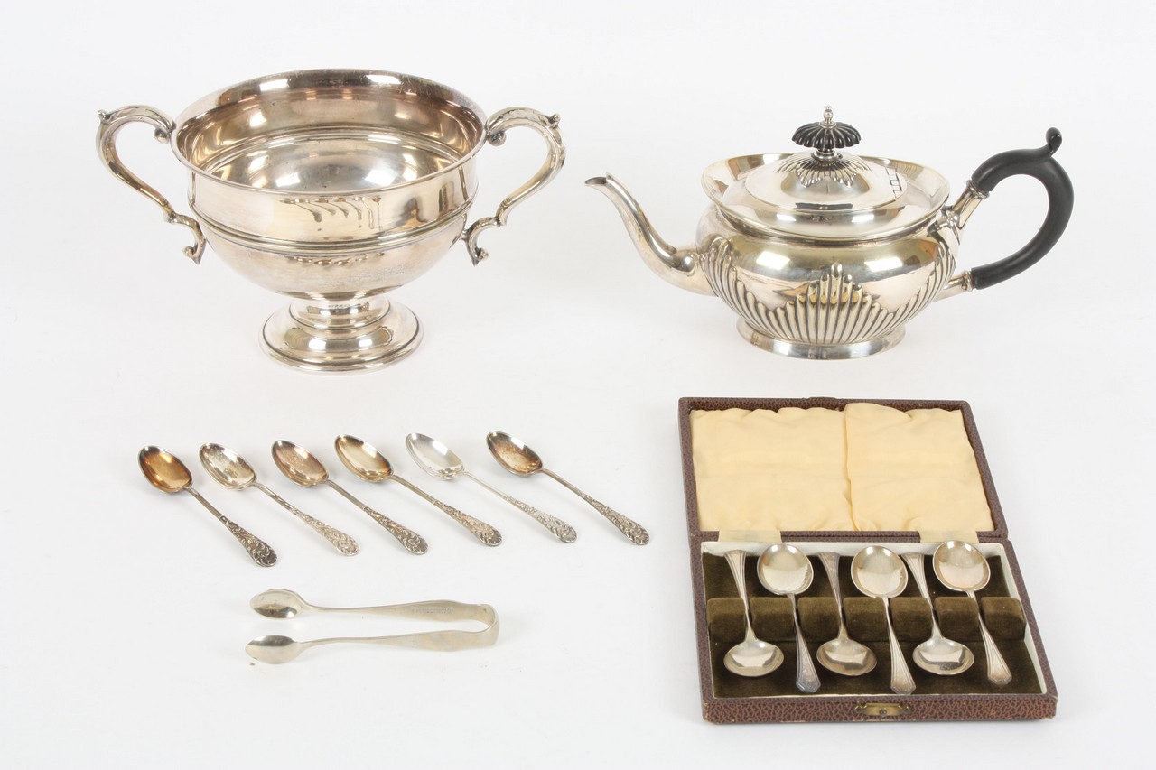 A collection of silver plate, comprising a two handled rose bowl, a tea pot, a set of six silver