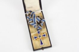 A German Third Reich Mother`s Cross, gold class, with ribbon in a fitted presentation case from