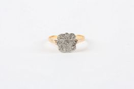 An 18ct gold square shaped ring, set with nine small diamonds in circular settings In good overall