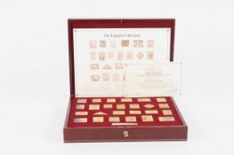 The Empire Collection, a set of twenty-five Commemorative silver gilt replica postage stamps in a