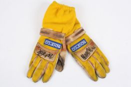 A pair of racing gloves signed and worn by Racing Driver Martin Brundle, each of the Sparco gloves