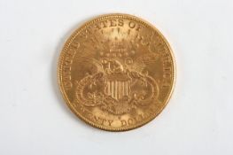 A 1904 American twenty dollar gold coin, 33.5 grams Some wear in places.