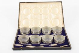 A cased set of eight butter dishes and knives retailed by J. C. Vickery of Regent Street, circa