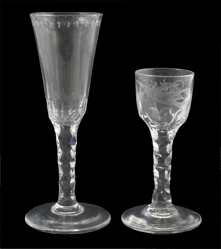An 18th century drinking glass with flared funnel bowl and an 18th century cordial glass with cup-