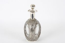 A Chinese white metal whisky decanter, the shaped moulded glass decanter with applied white metal