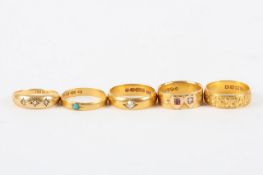 Five gold wedding bands, comprising three 22ct gold rings one set with turquoise, one set with