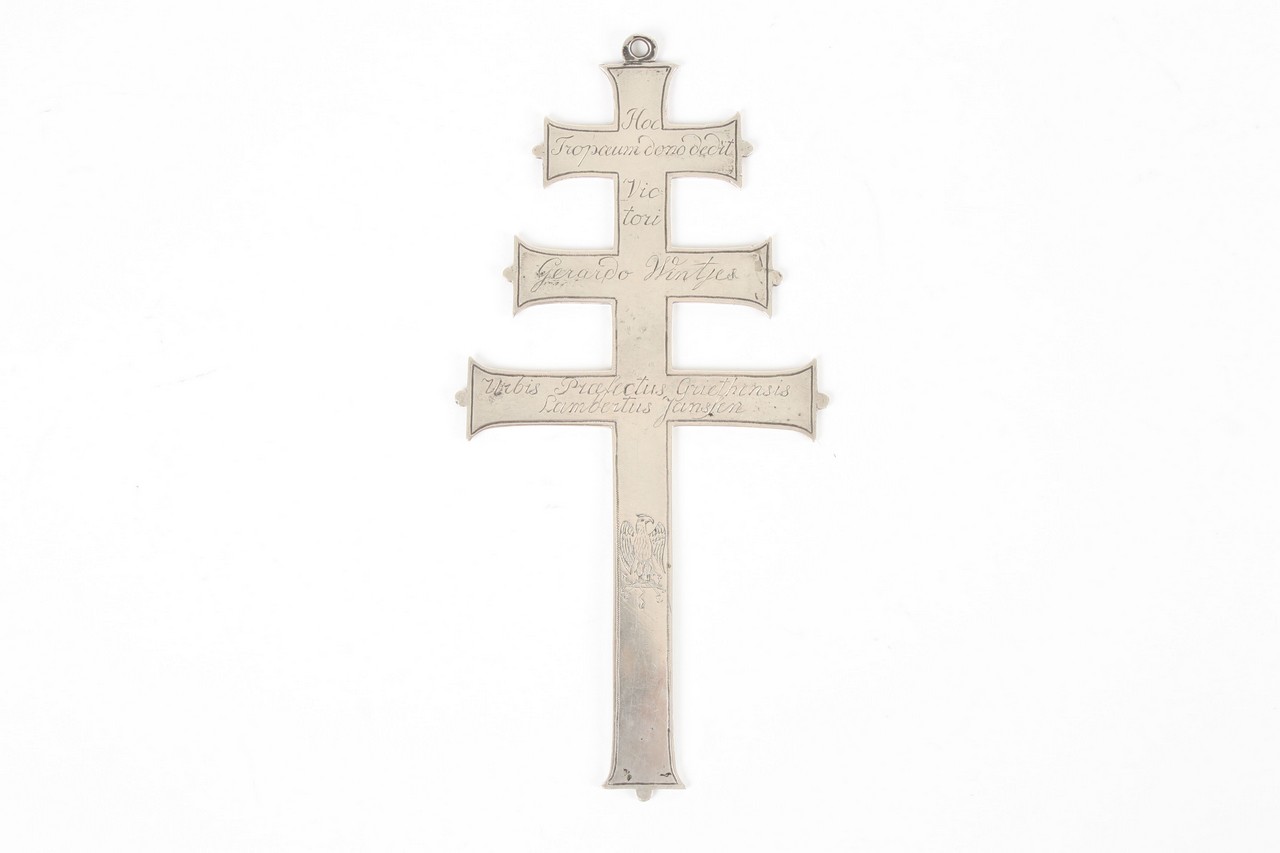 A triple bar silver coloured metal cross, circa 1811, engraved on the front and the reverse,