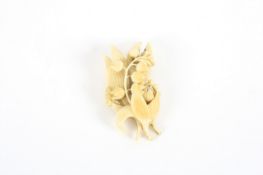 A Victorian ivory lily of the valley brooch, realistically modelled with pin to the reverse. 8cm