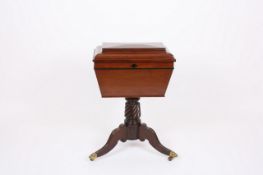 A William IV mahogany wine cooler, the sarcophagus shaped rising top with vacant interior and