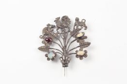 An unusual 19th century white metal and opal brooch possibly from Peru, with pierced frame and