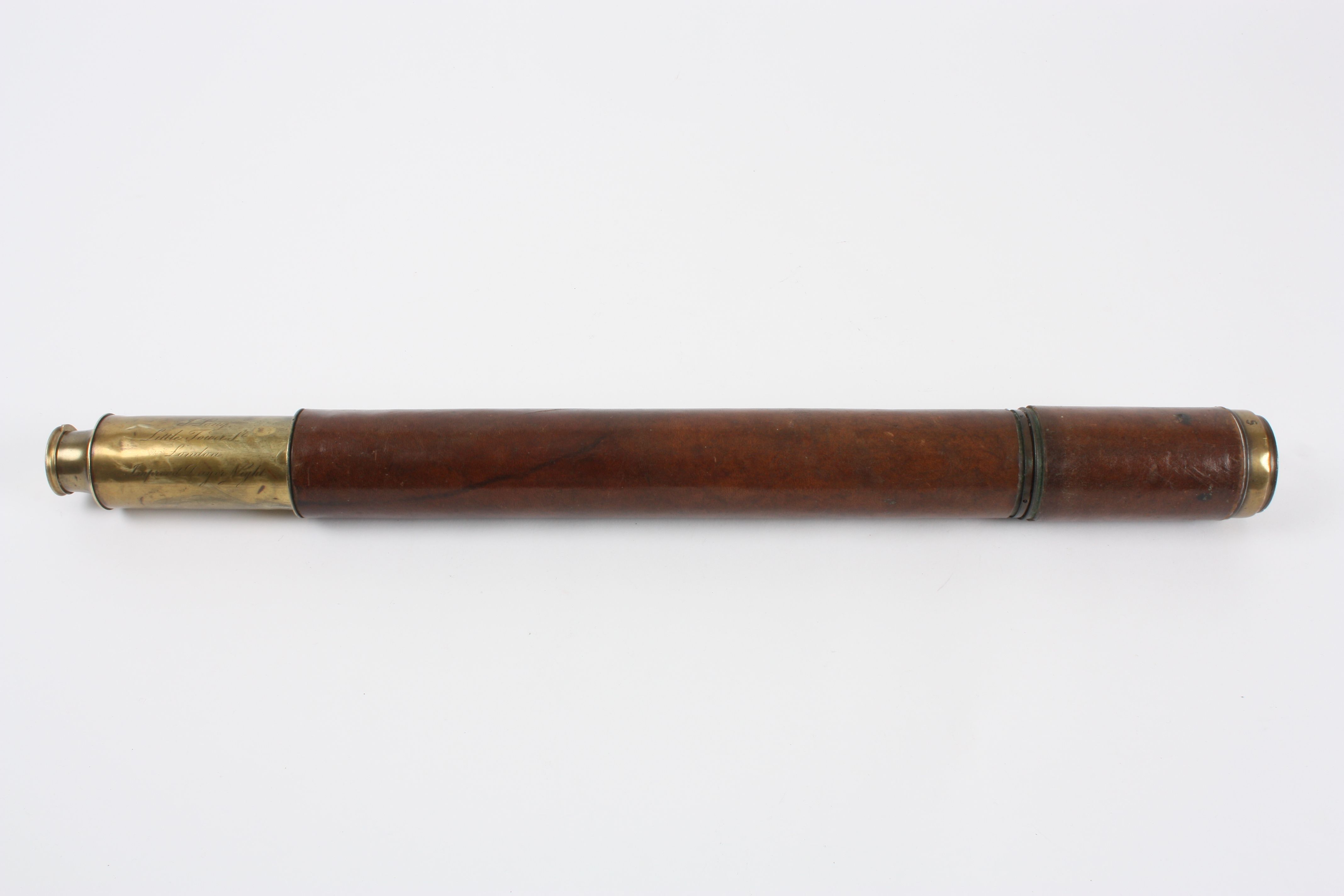 An early 19th century single draw day or night brass telescope signed J. Long Little Tower Street,