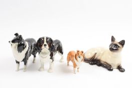 A group of four Beswick animals comprising a King Charles spaniel, a Siamese cat and two Collies.