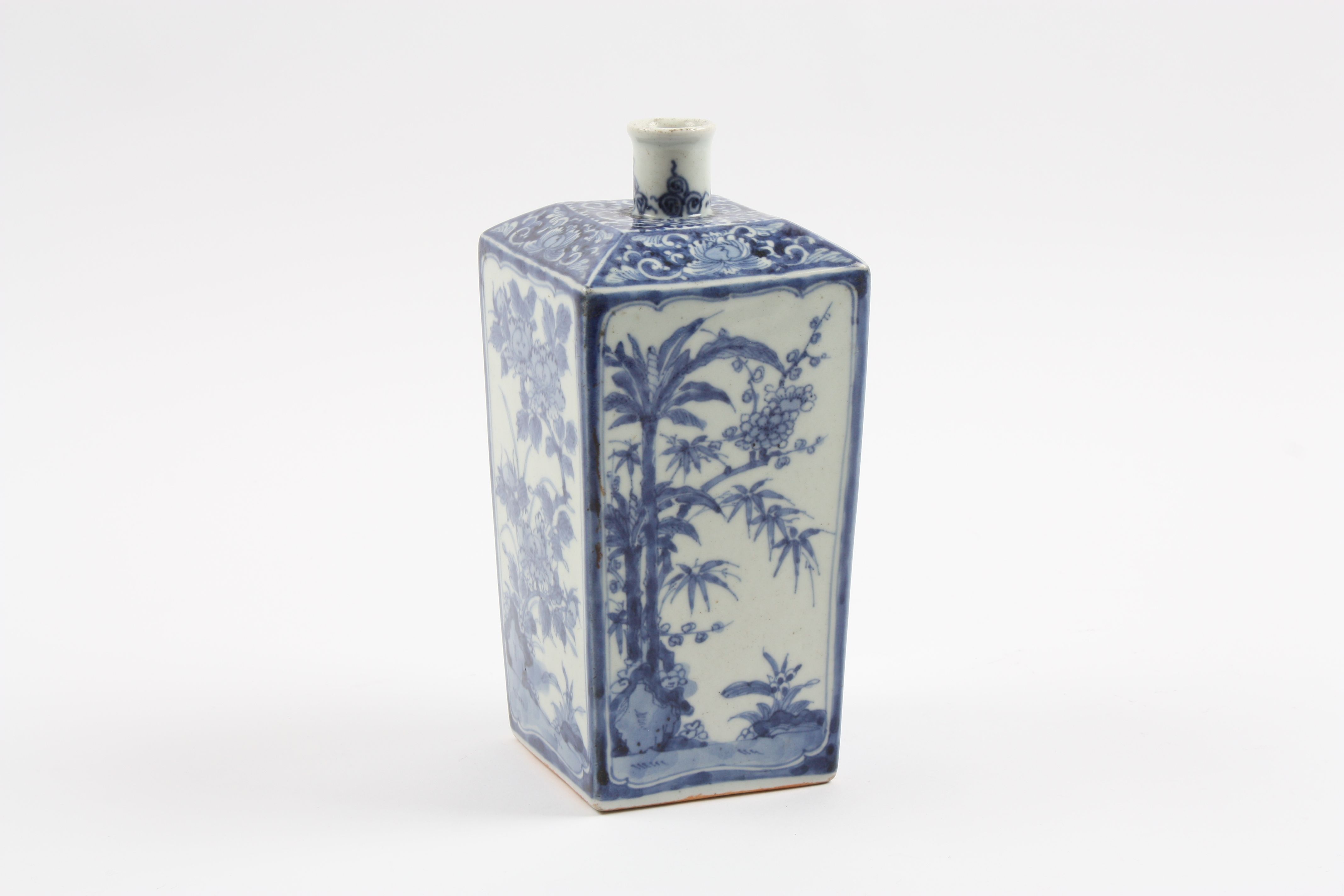 A Chinese blue and white bottle vase late 19th or early 20th century, the square tapering body
