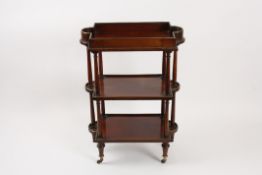 A Regency mahogany shaped-top three tier etagere?with brass bound rims, the top with sliding