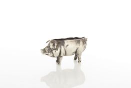 A silver pin cushion in the form of a pig circa 1900 missing liner, rubbed mark length 5.5cm