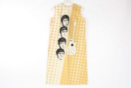 A beige coloured polka dot Beatles dress Dutch,1960s decorated with printed faces of the Beatles and