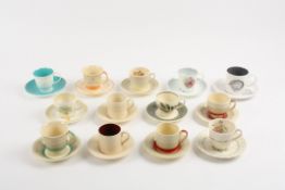 A Collection of assorted Susie Cooper cups and saucers comprising 13 cups and saucers in various