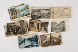 A collection of early 20th century postcards all unused, covering subjects including: buildings,