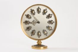 A large Jaegar le Coultre eight day brass pedestal mantle clock the silvered circular dial set