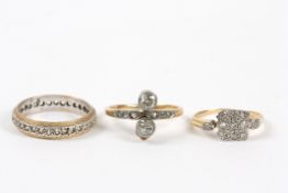 Three gold and diamond rings comprising a two stone diamond ring, the shoulders set with a row of