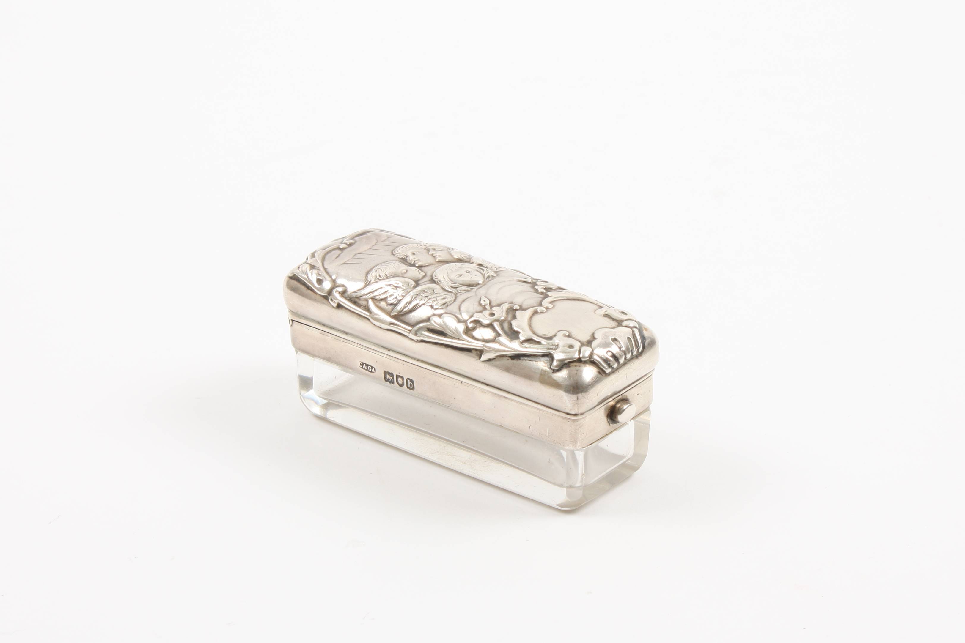 An Asprey of London silver pin box hallmarked London 1897, the sprung hinged lid embossed with