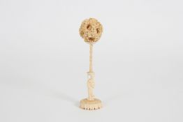 A Chinese carved ivory concentric ball on stand early 20th century, the ball of eight layers and