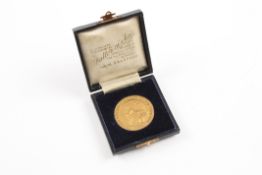 A 1914 9ct yellow gold Printing, Stationery & Allied Trades Exhibition medallion, the reverse with