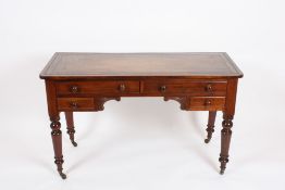 A Victorian mahogany kneehole writing desk?with green tooled leather top over two larger and two