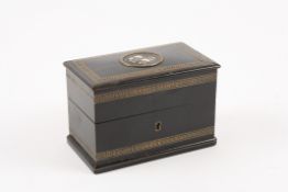 A 19th century French ebonised bottle box by Tahan the top with brass Greek Key pattern inlay, and