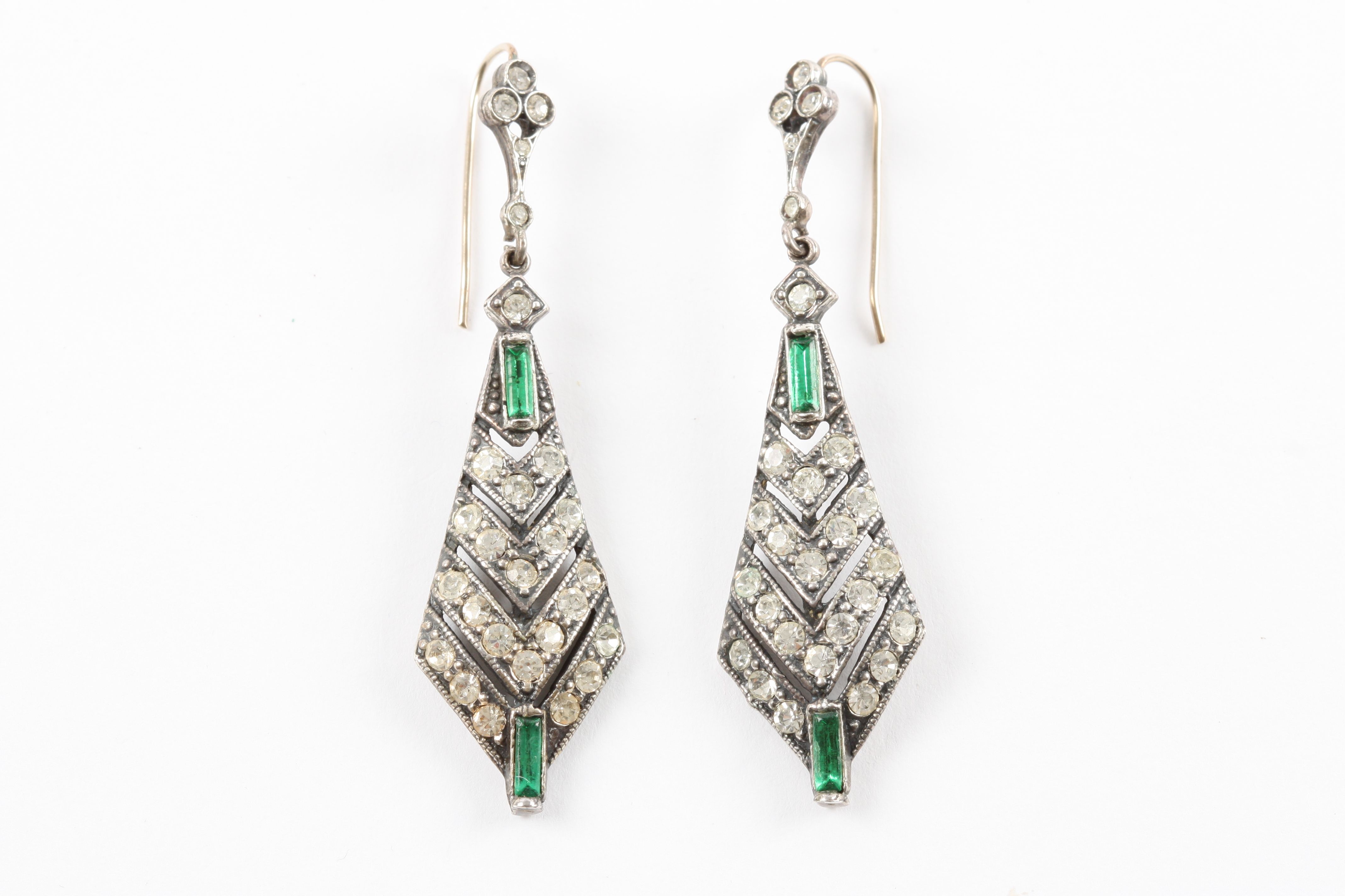 A pair of Art Deco style costume jewellery earrings formed as suspended arrow heads with rows of